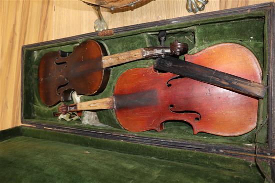 Two violins in a mahogany box and a collection of violin bows